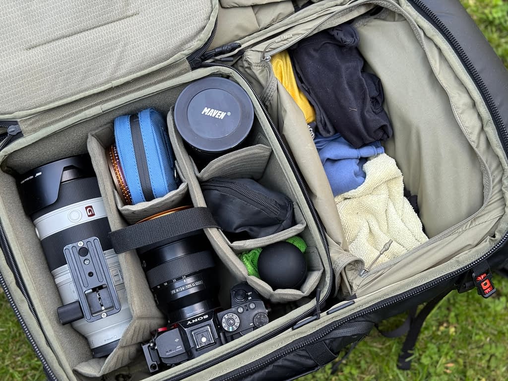 A camera rucksack containing a woodland photography packing list holds a camera, three lenses, a small reflector, a rocket blower, filters and assorted towels. I keep my camera gear minimal so that I have more space for things that keep me comfortable so I can stay out shooting for longer in more challenging conditions.