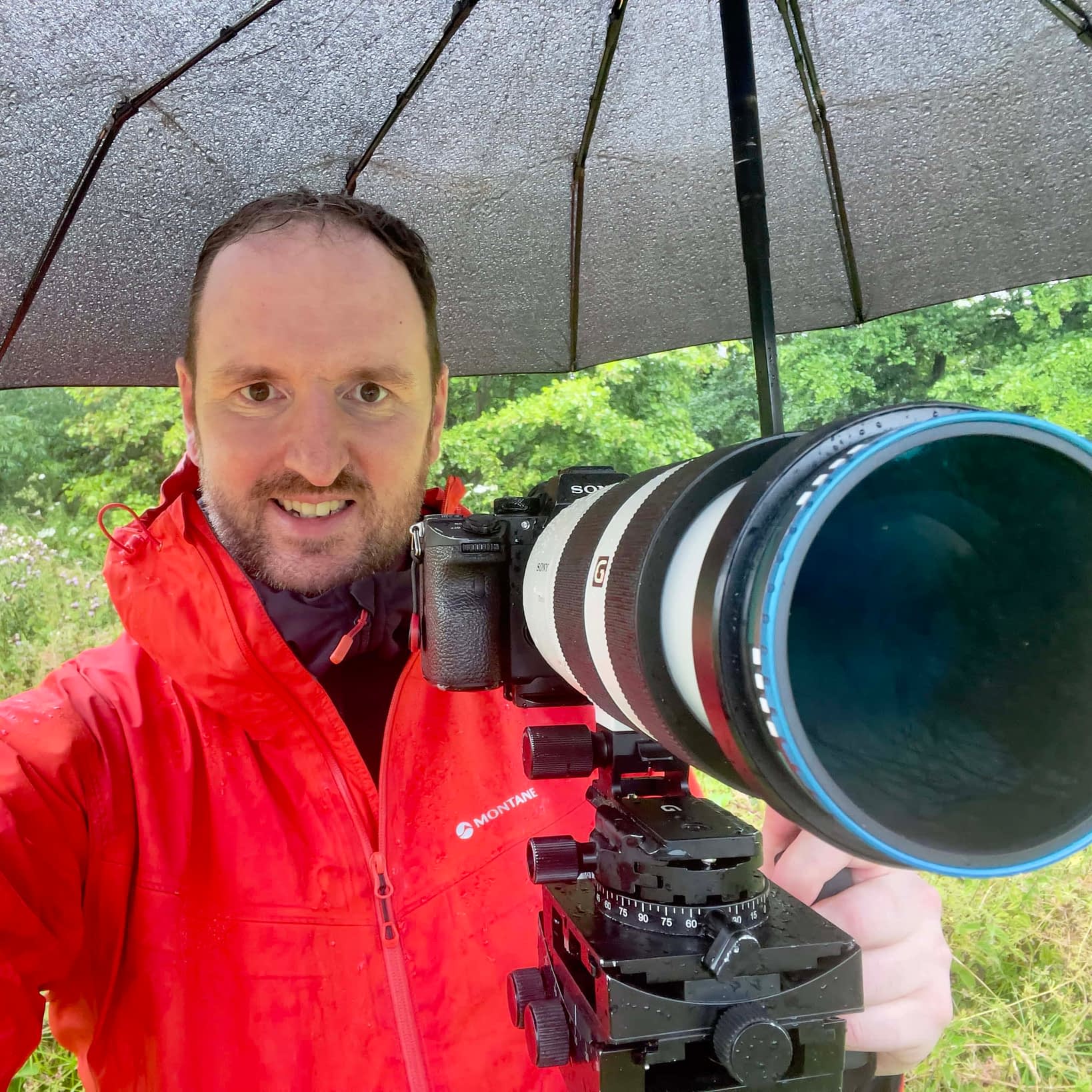 Tim Smalley A photograph of woodland photographer Tim Smalley out in the woods on a rainy day.