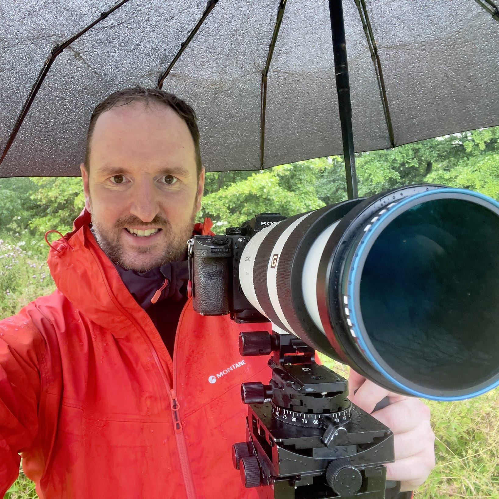 Tim Smalley A photograph of woodland photographer Tim Smalley out in the woods on a rainy day.