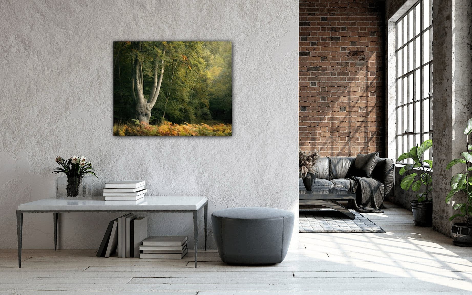 print-hp Contemporary lounge with large windows, exposed brick, and white plaster wall. Forest painting above minimalist desk; ottoman and sofa behind.
